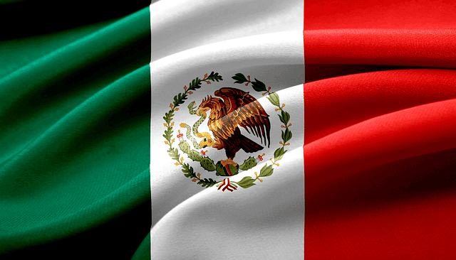Waving flag of Mexico with emblem